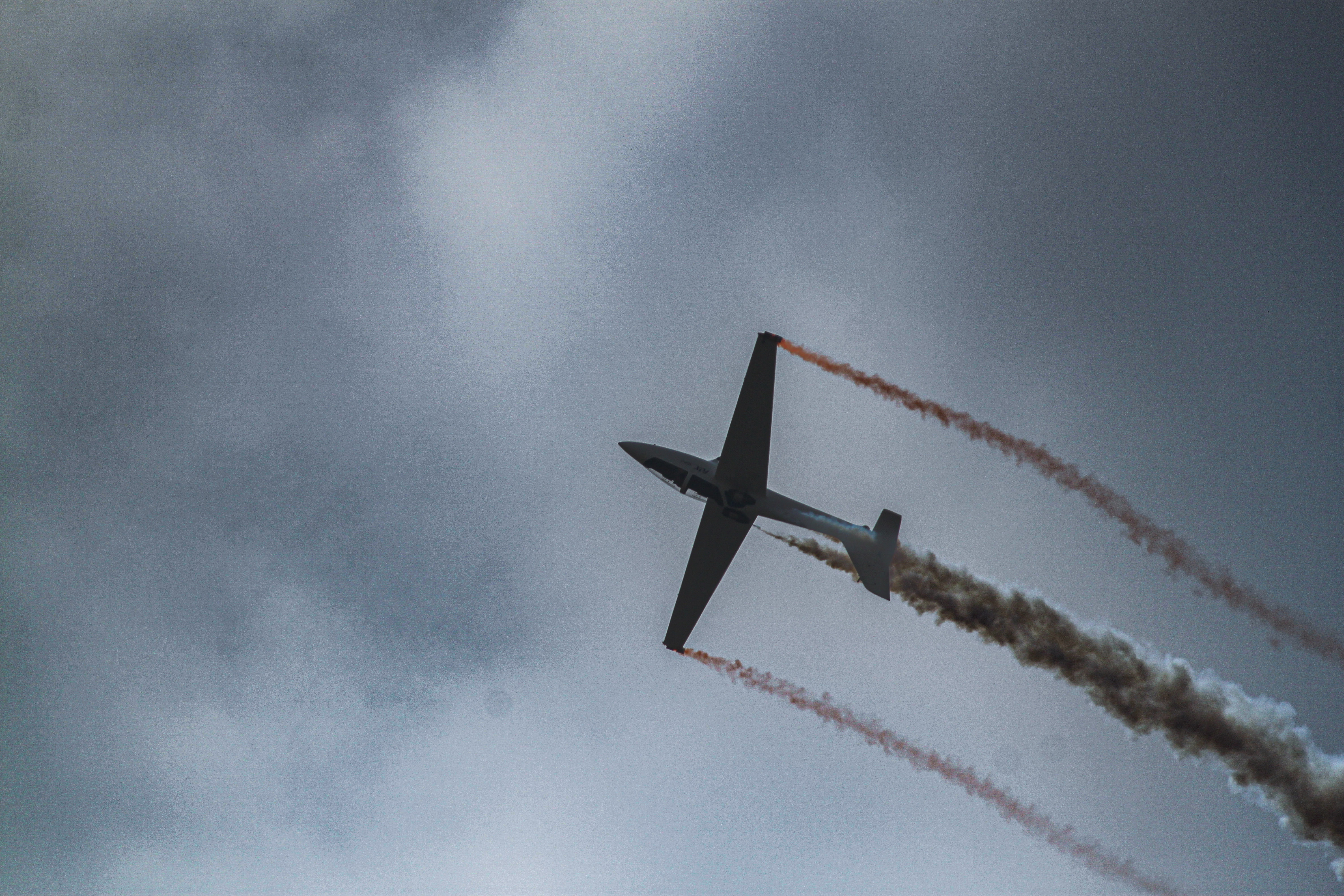 Aerobatic plane banking with vapor trails